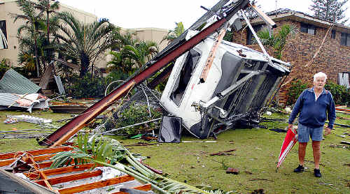 Graham Ellis after the tornado that hit Lennox overturned his caravan, relocating it to the next door neighbour’s yard. Graham Ellis after the tornado that hit Lennox overturned his caravan, relocating it to the next door neighbour’s yard.